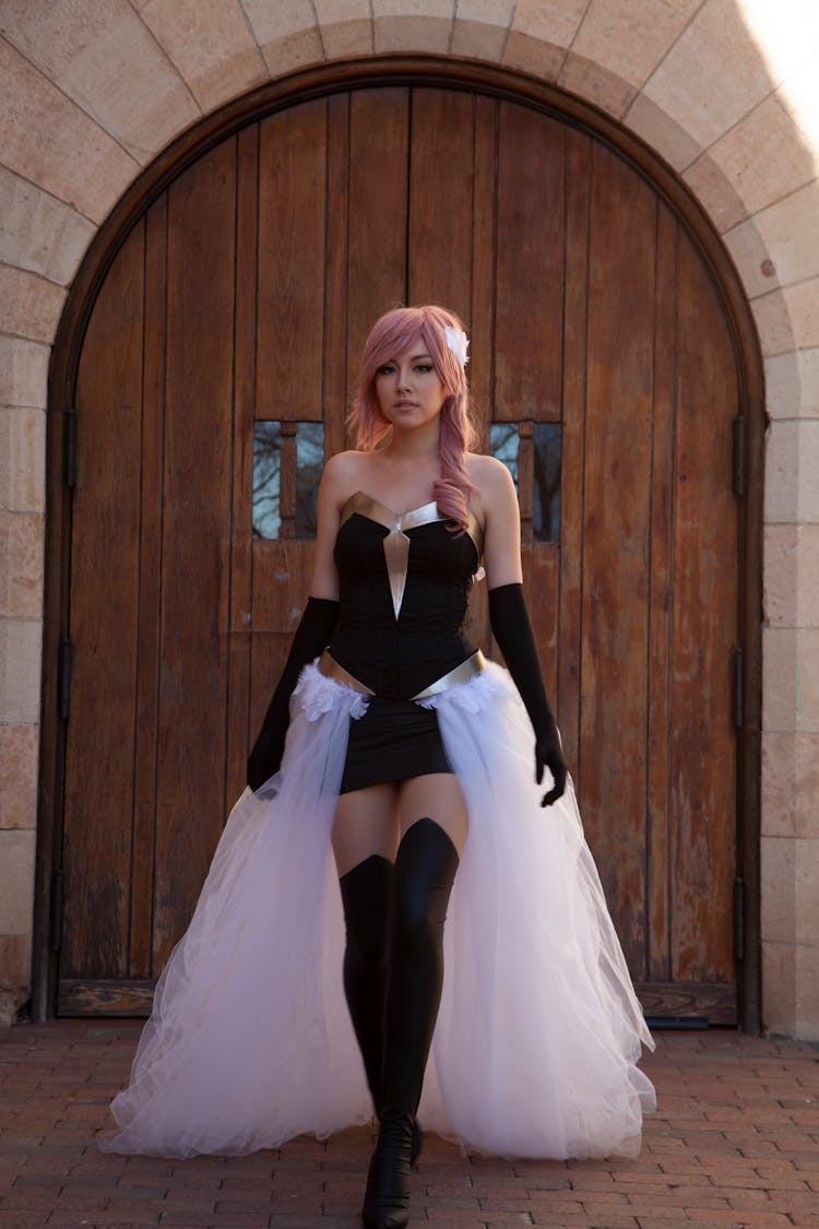 Woman Posing In Skirt By Wooden Door