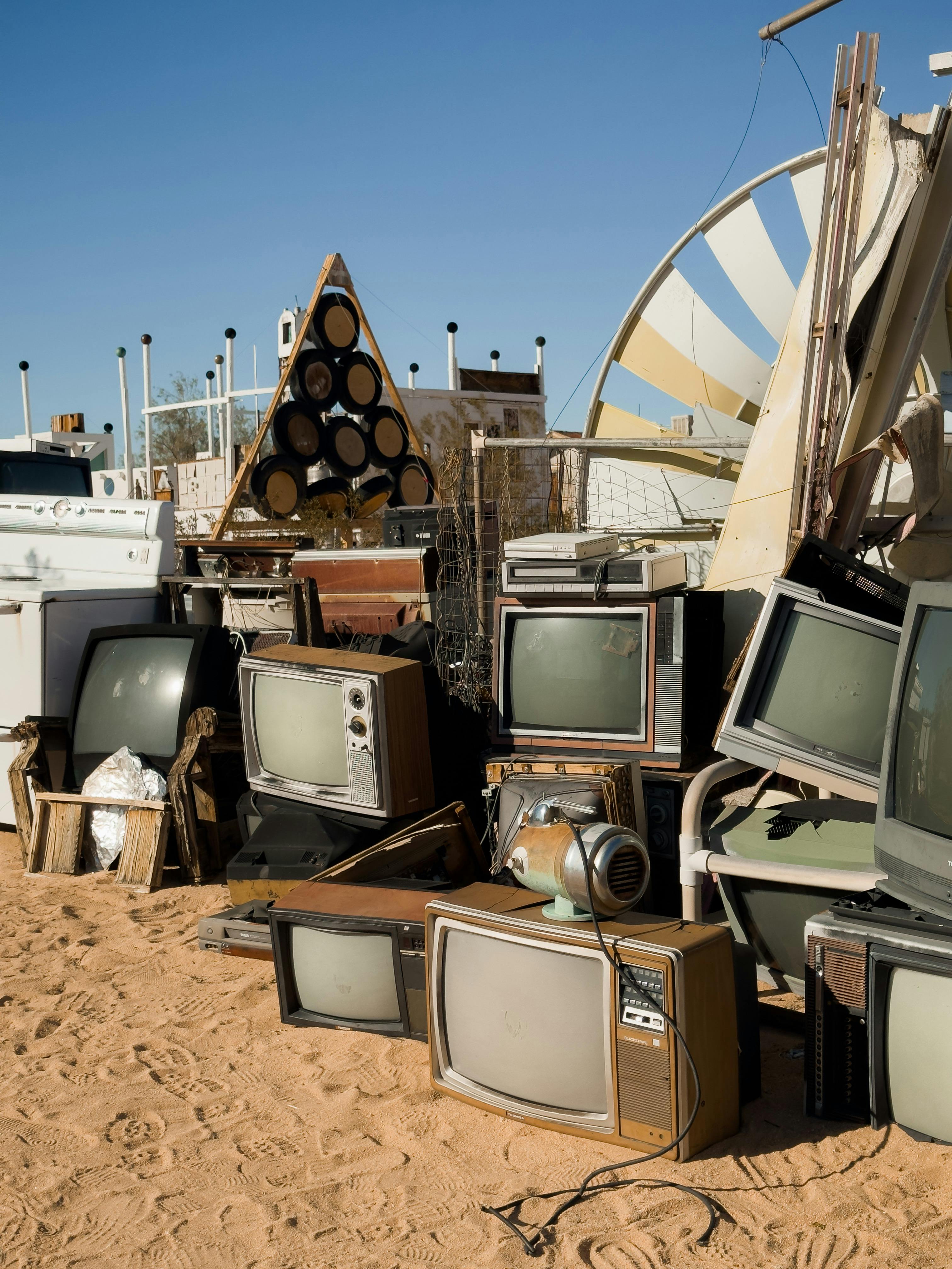 Pile of Old CRT TVs in the Desert Landfill · Free Stock Photo