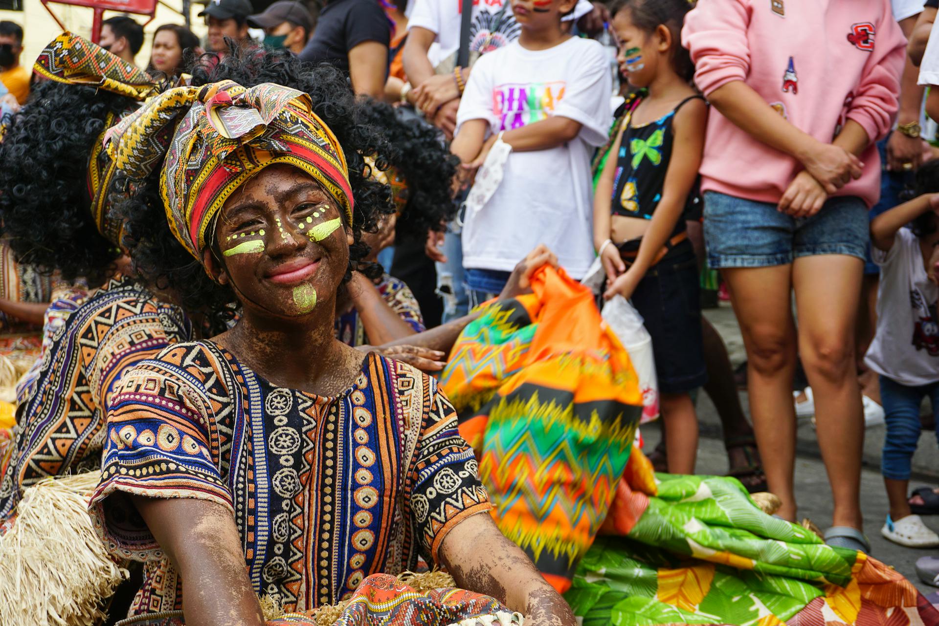 Vibrant image of the Ati-atihan Festival in Iloilo City showcasing traditional costumes and joyous celebrations.