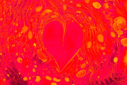 A colorful abstract image featuring a heart shape with swirling patterns in vivid red and yellow hues.