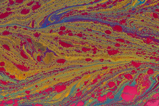 Colorful abstract fluid art with earth tones and vibrant patterns.
