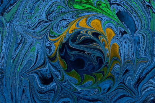 Dynamic fluid art design with swirling patterns in blue, green, and yellow hues.