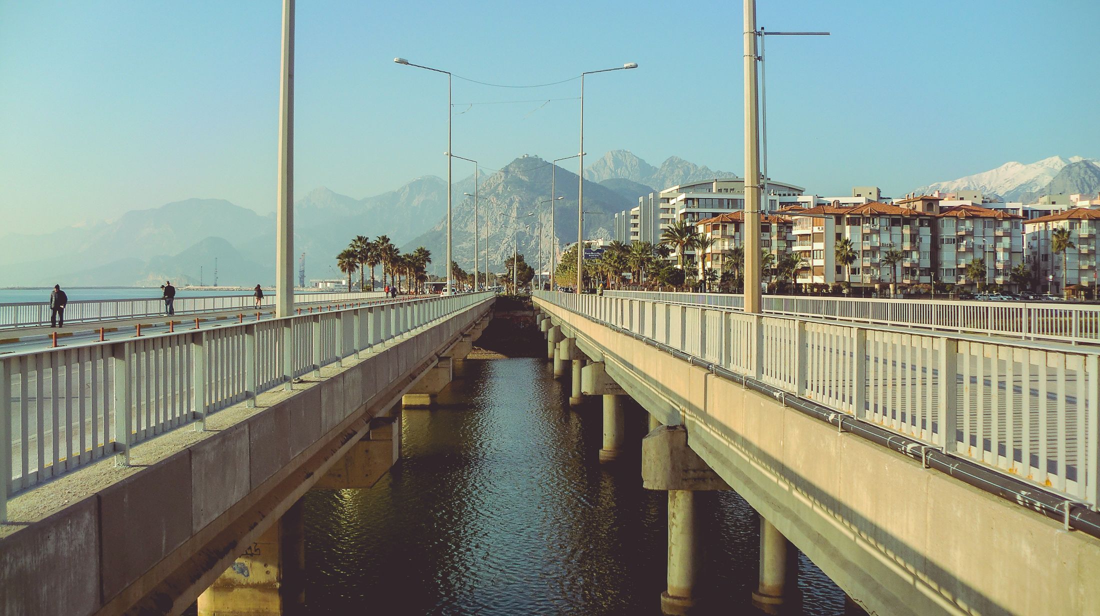 Context photograph: Coastal bridge and waterways beneath a mountain backdrop. Not a VIEWPIECE acquisition or analysis.
