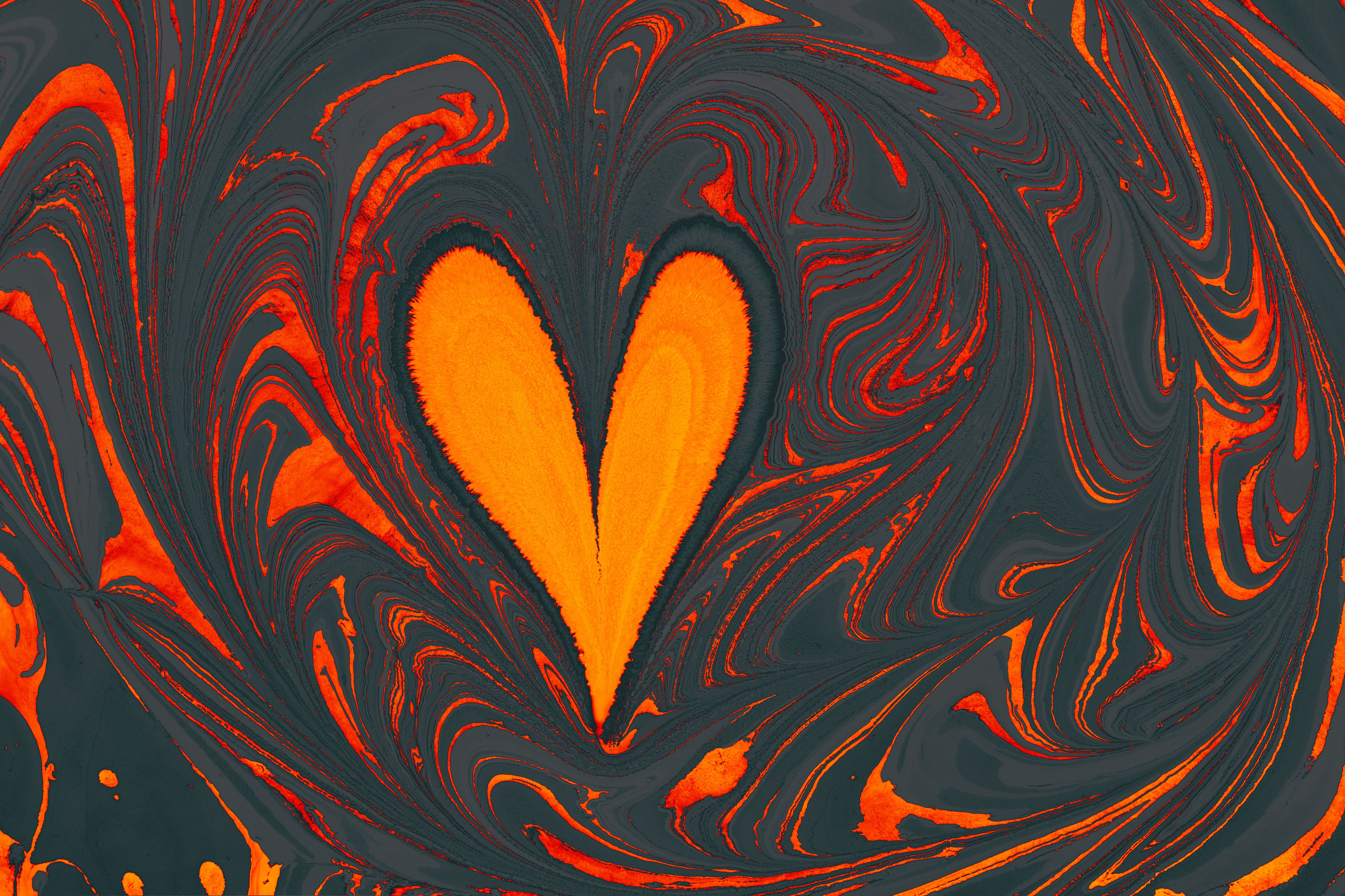 A heart shaped orange and black swirl painting · Free Stock Photo