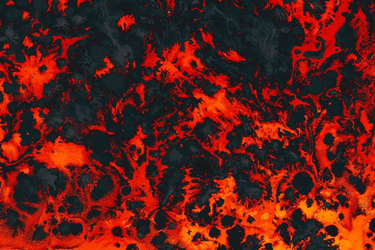 vibrant fluid art piece with fiery orange and black abstract patterns
