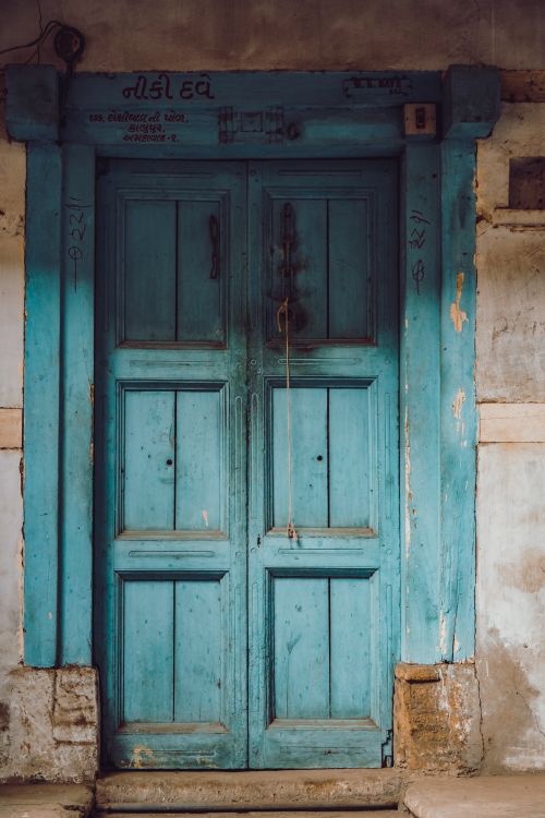 Free Explore the charm of an old wooden door in Ahmedabad, showcasing historic architecture. Stock Photo