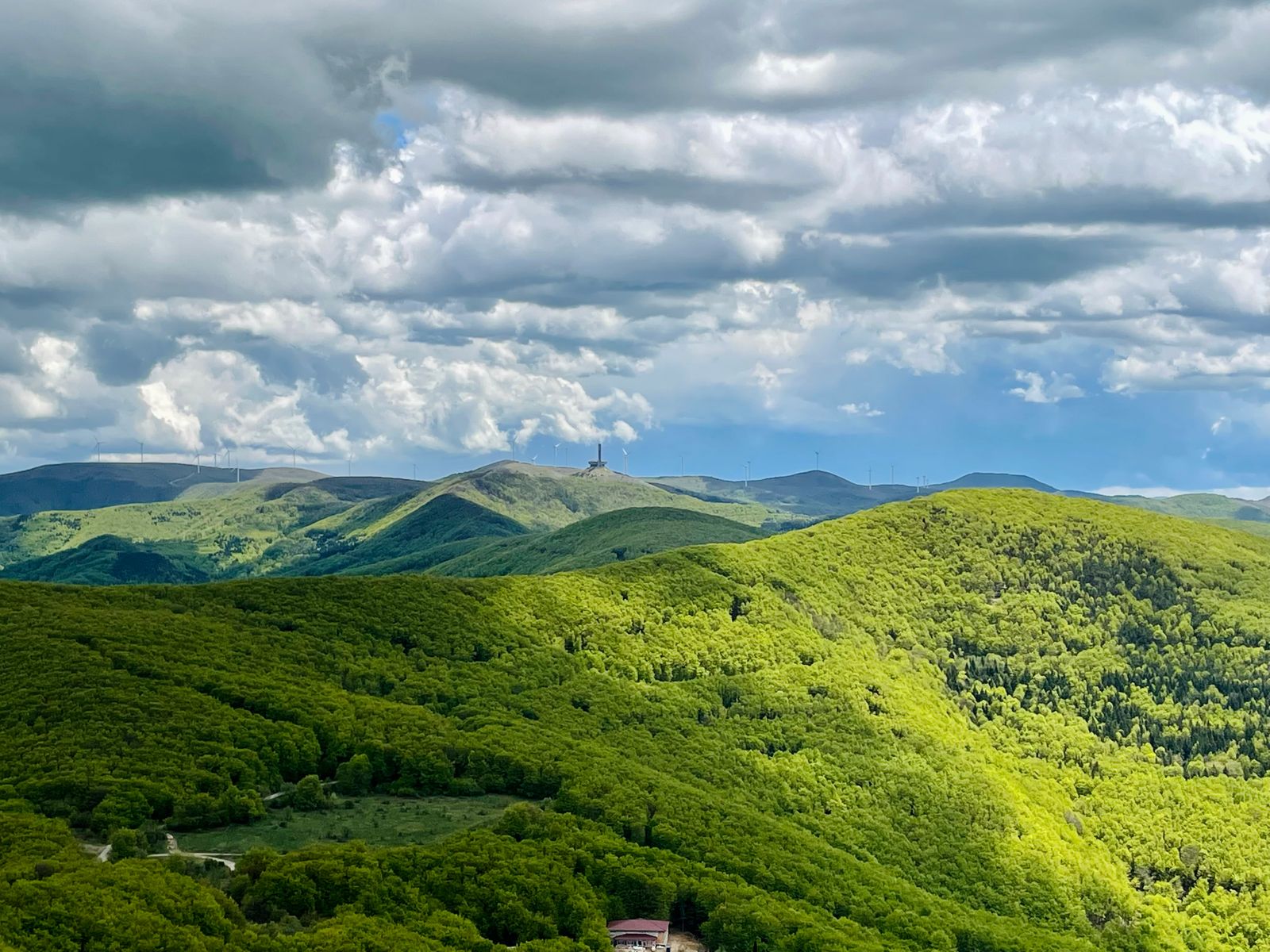 Clouds over green hills, representing the Deccan plateau countryside around Dharwad