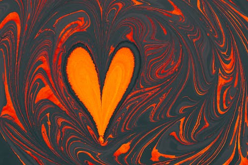 Close-up of a Colorful, Abstract Painting with a Heart Shape in the Middle 
