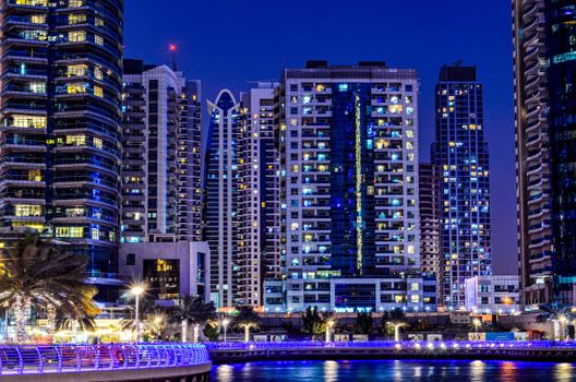 A stunning view of Dubai Marina's modern skyline illuminated at night.