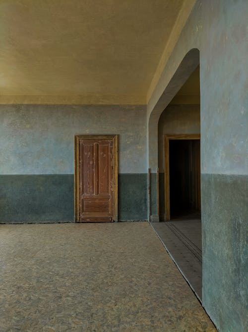 Brown Wooden Door on Concrete Wall