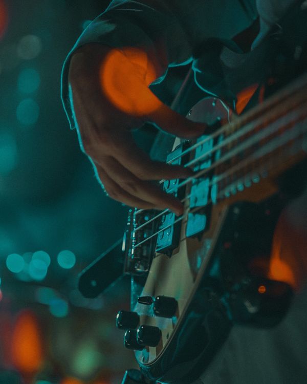 A Person Playing a Bass Guitar · Free Stock Photo