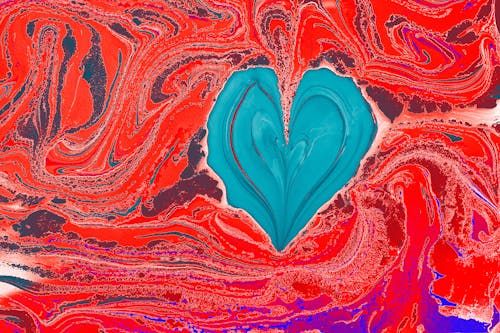 Close-up of a Colorful, Abstract Painting with a Heart Shape in the Middle 