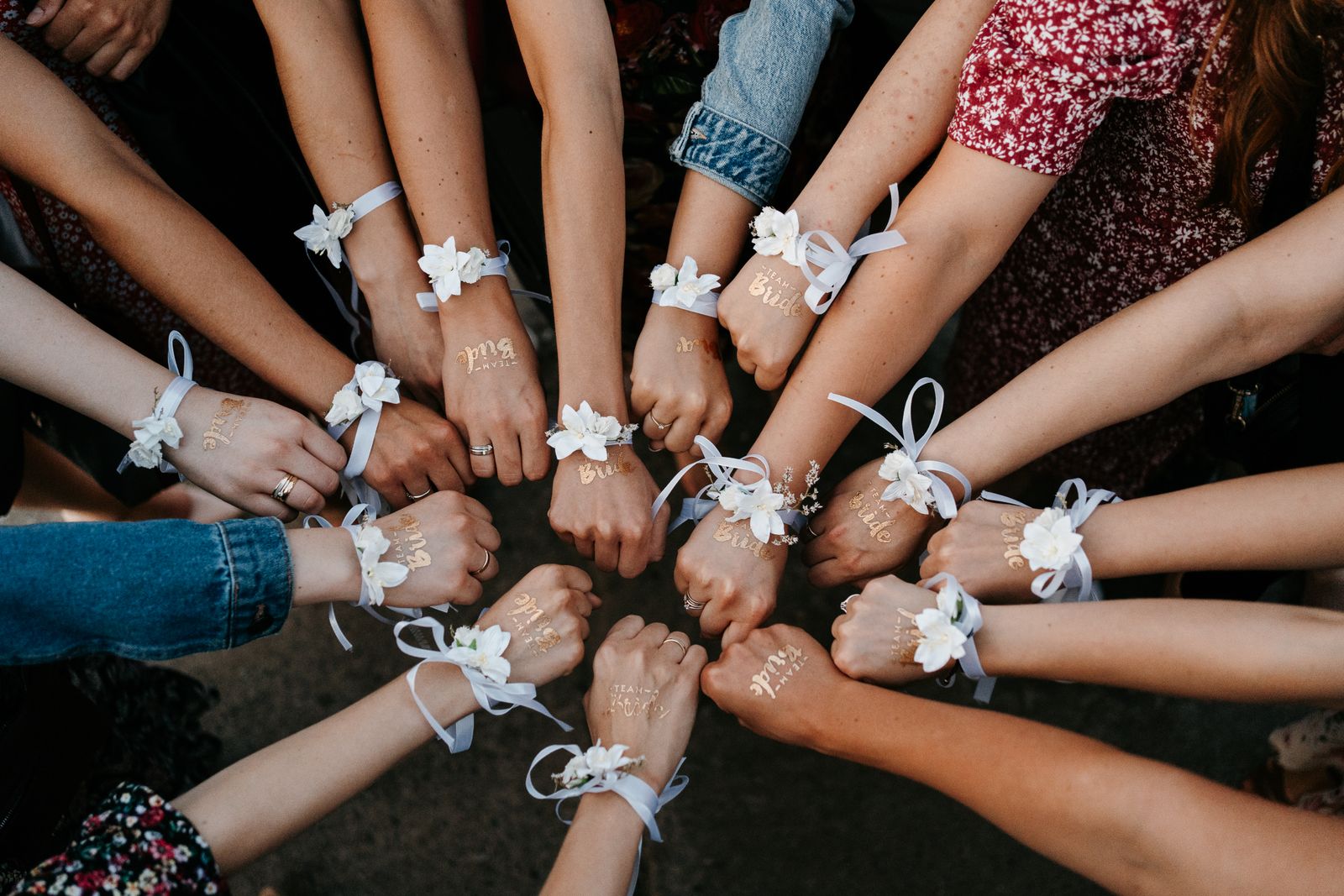 Women with matching friendship bracelets at a bridal party celebration