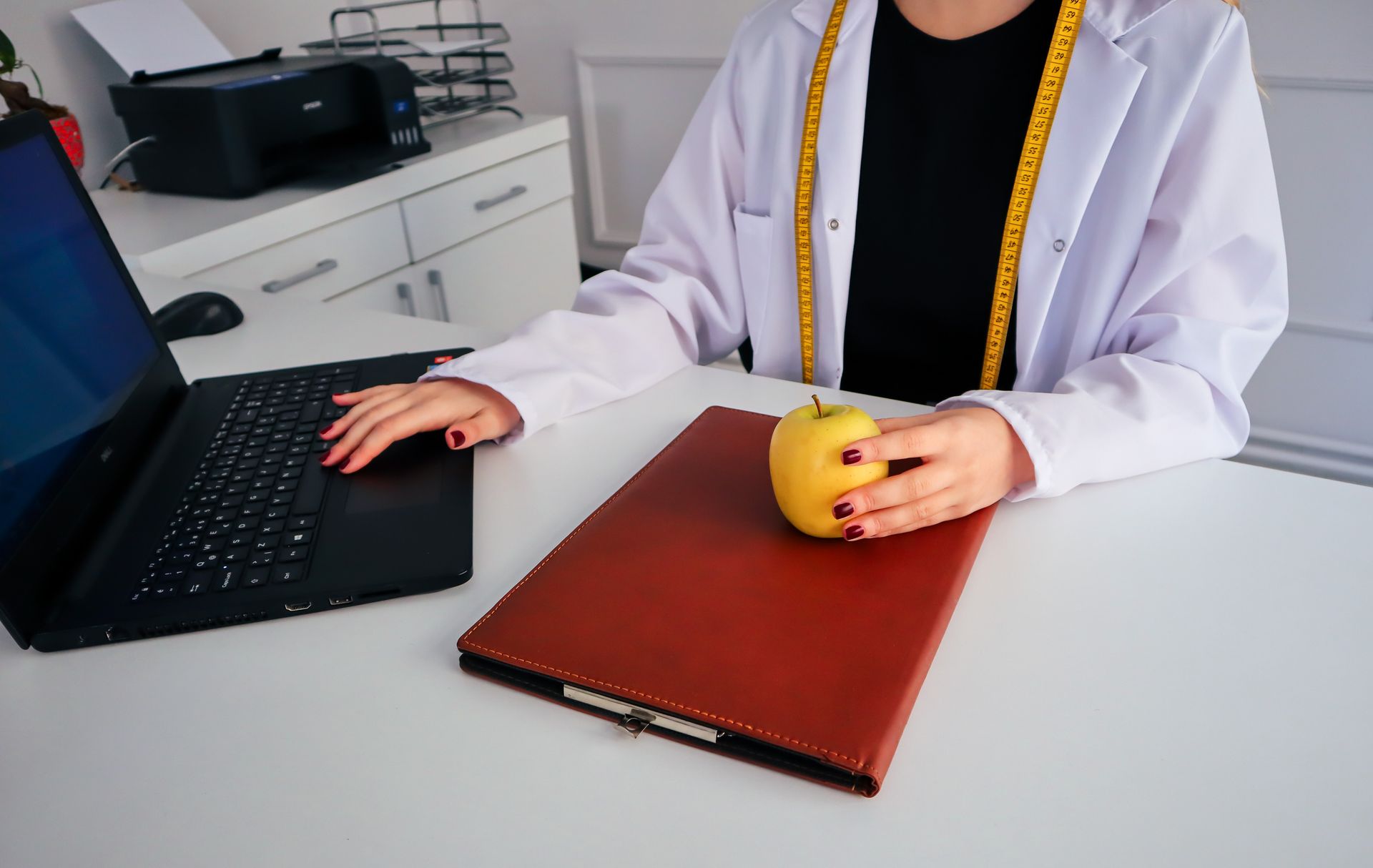 Dietician Working on Laptop