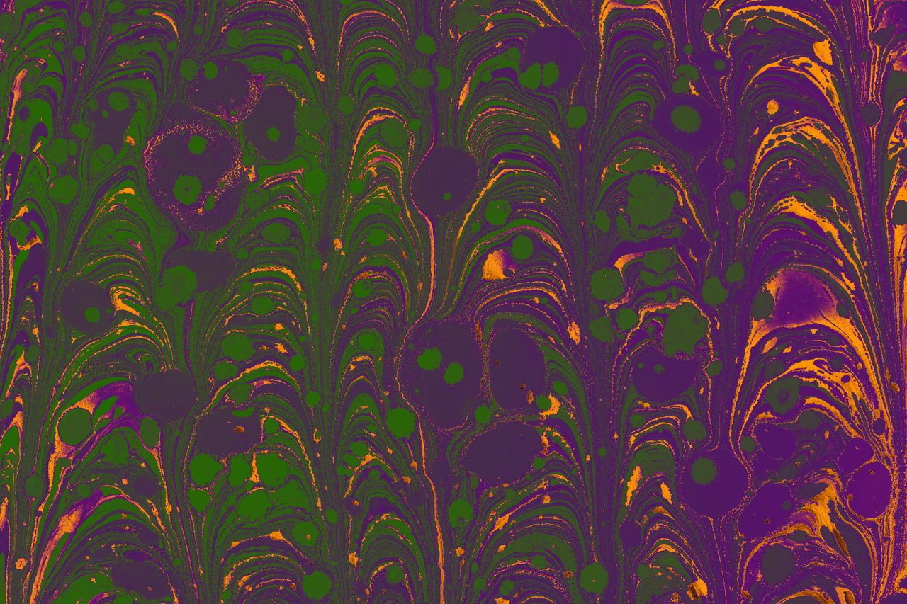 colorful marbled pattern with green purple and orange swirls for artis