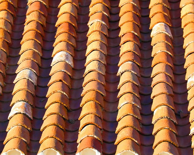 Rows of roof tiles Repeating rows of terracotta-colored roof tiles