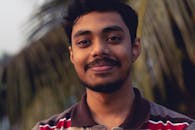 A Man Smiling at the Camera