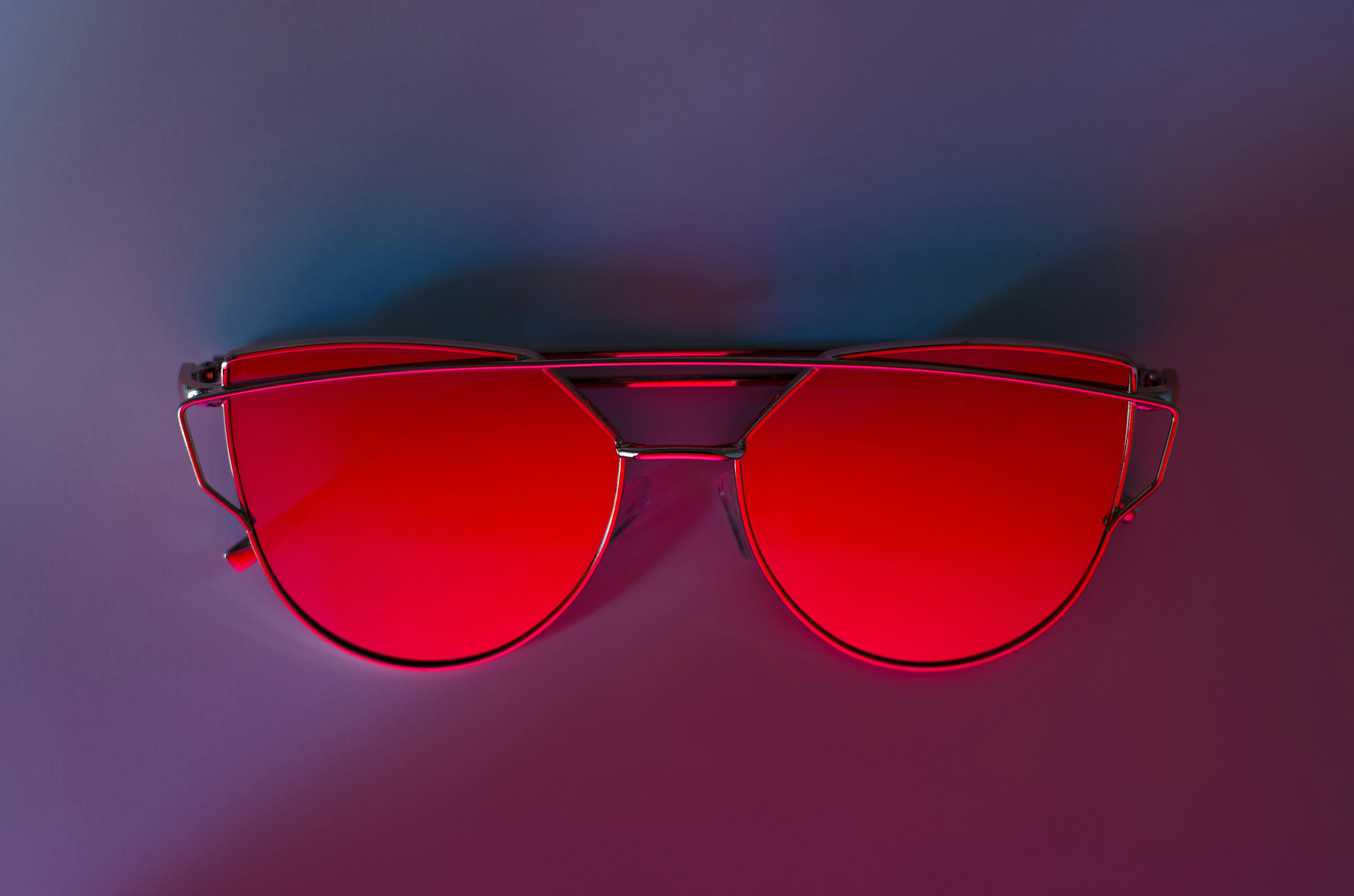 Red Sunglasses on Pink Surface · Free Stock Photo