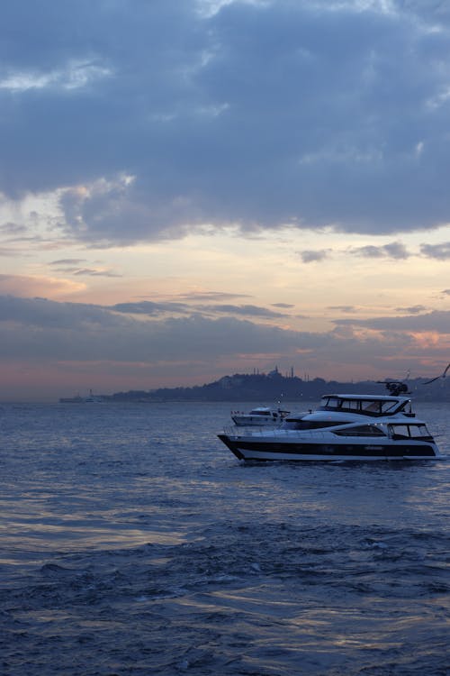 Clouds over Sailing Motor Yacht