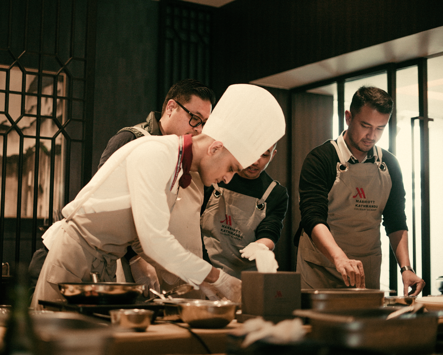 Culinary Institute vs Cooking Class in India: What's the Difference and Which Is Right for You? 4 A team of chefs collaborate in a modern restaurant kitchen preparing dishes with precision.