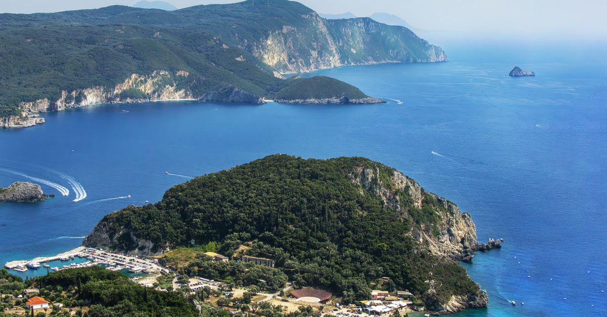 Wooded cliffs and blue water in the Ionian islands