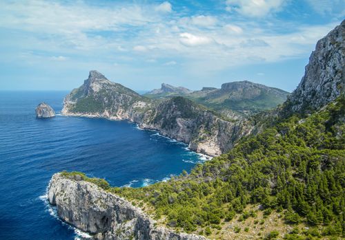 Free Breathtaking aerial view of the rocky coastline and turquoise sea in IB, Spain. Stock Photo