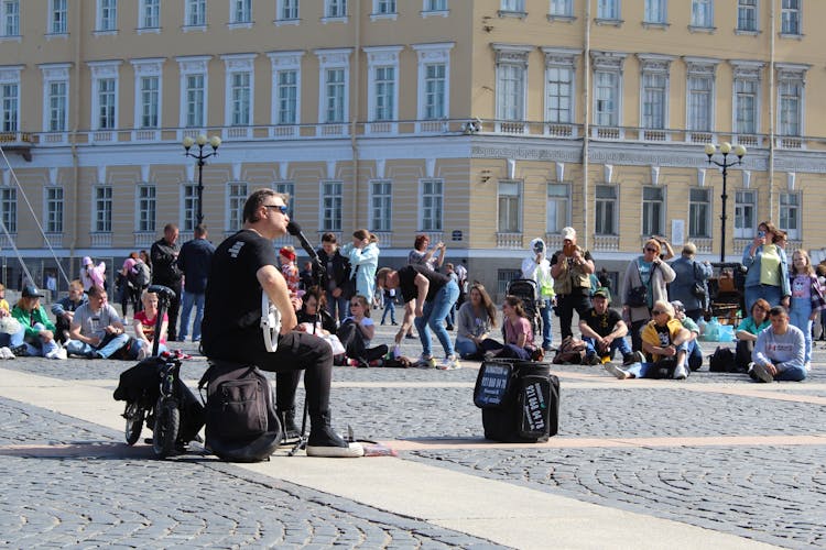 People Watching Concert On Pavement In Old Town