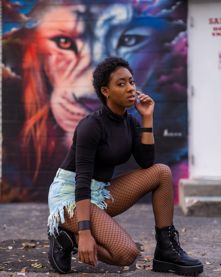 Woman Posing With Mural Behind