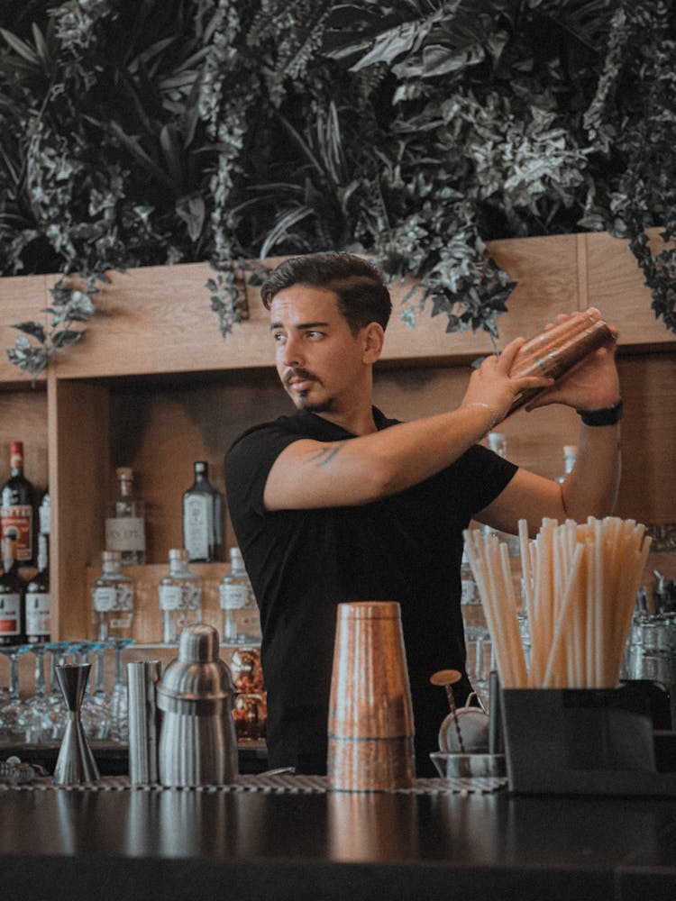 Man Making Cocktails At Bar