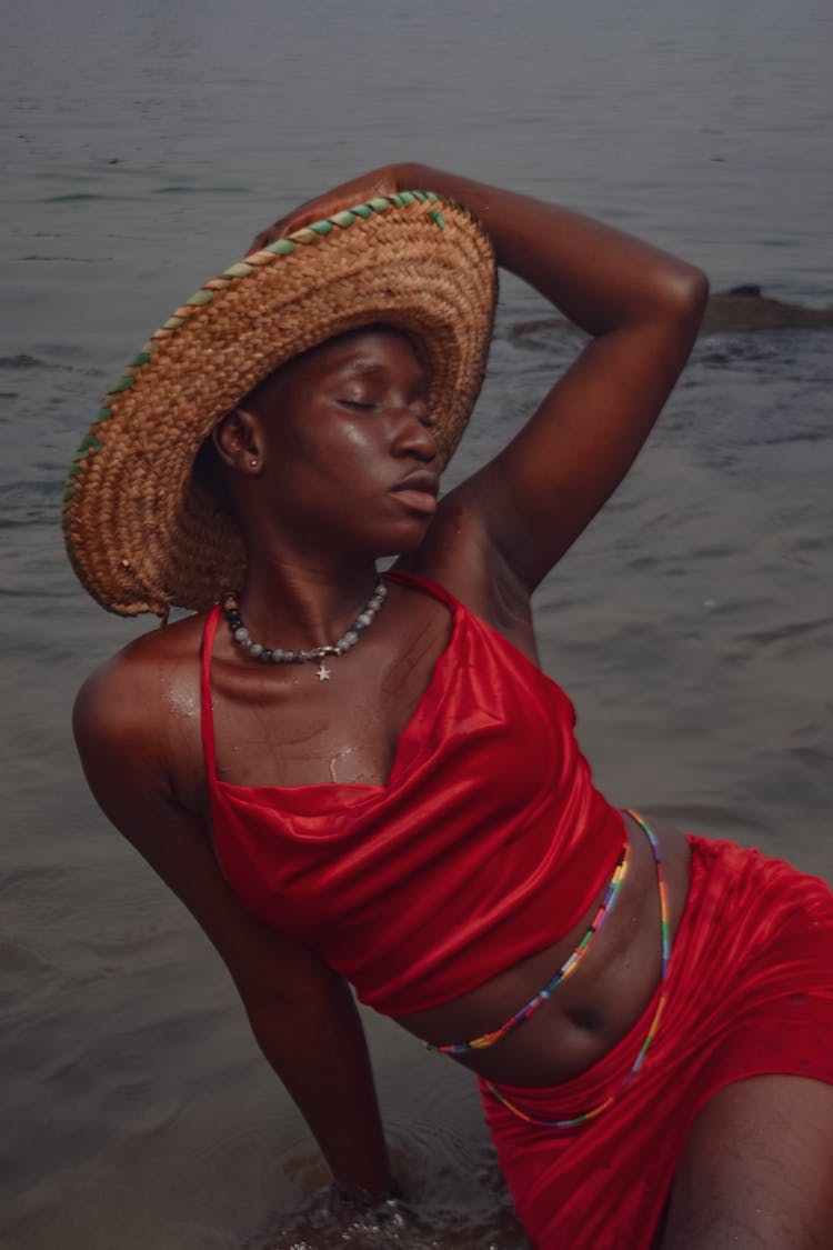 A Woman Sitting On The Beach