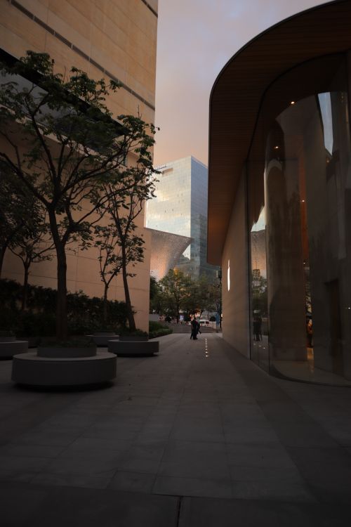 Free Contemporary architecture at sunset with an urban walkway and modern buildings. Stock Photo