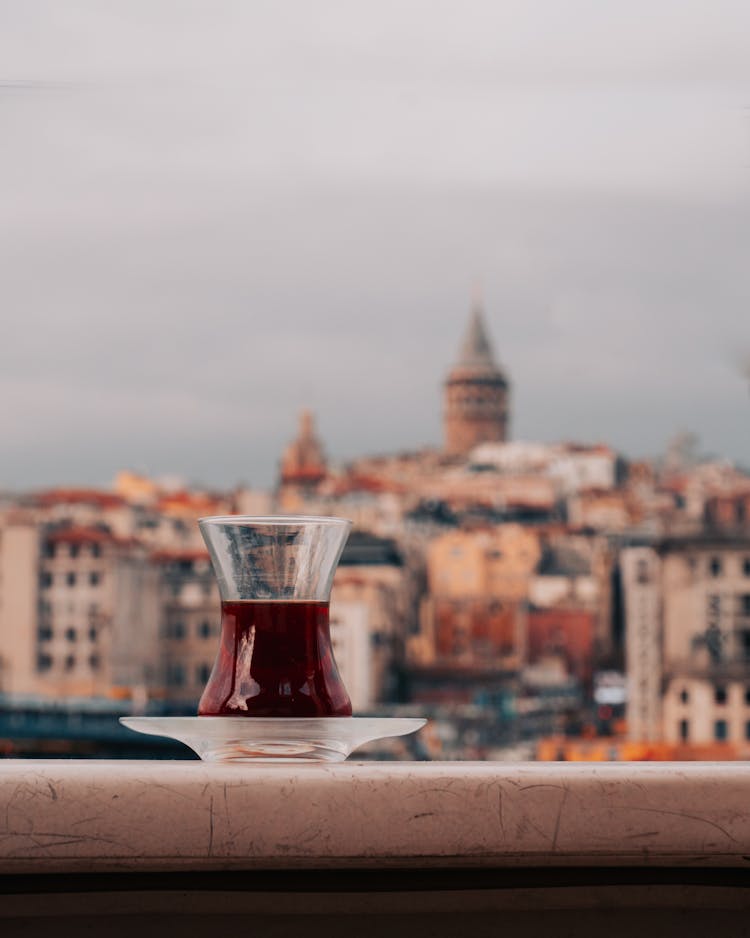 Black Tea In Traditional Glass On Cityscape Background