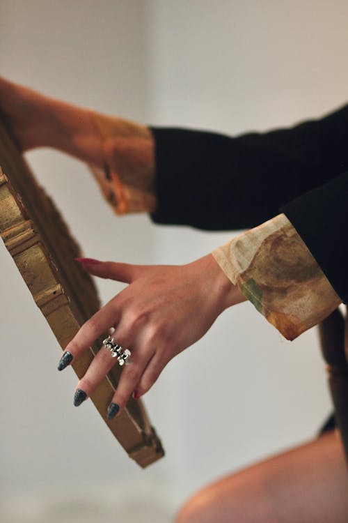 Close-up of Woman Holding Golden Board