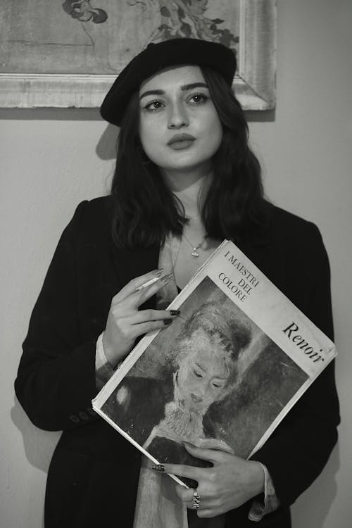 Woman Posing with Magazine about Renoir