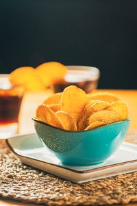 Bowl of golden potato crisps — photo by MikeGz on Pexels
