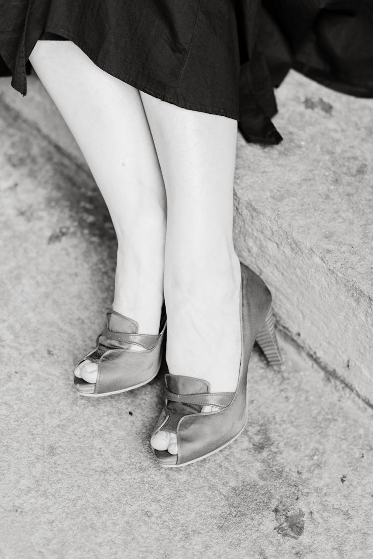 Grayscale Photo Of The Footwear Of A Woman