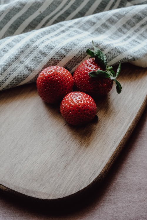 Ripe Strawberries Lying on a Cutting Board