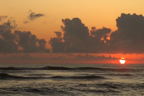 Free Stunning sunset view over the serene sea in Guaratuba, PR, Brazil. Perfect for tranquility and nature themes. Stock Photo