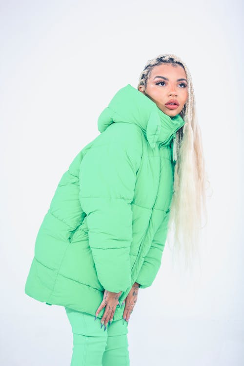 Female Model Posing in a Green Hooded Jacket