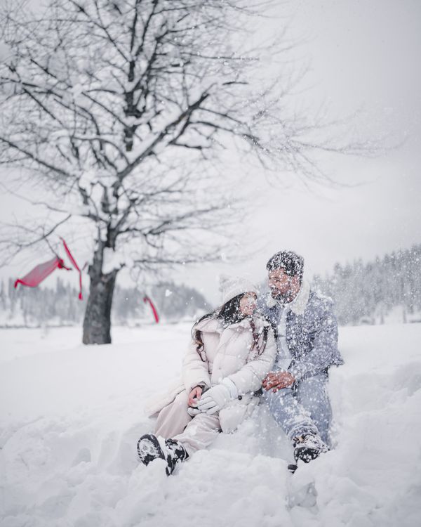 Couple enjoying a snowy landscape in winter