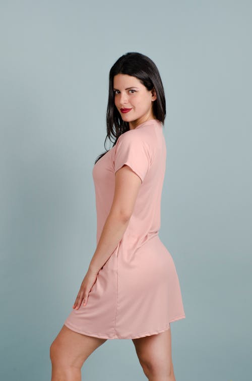 Studio Shot of a Young Woman in a Pink Dress