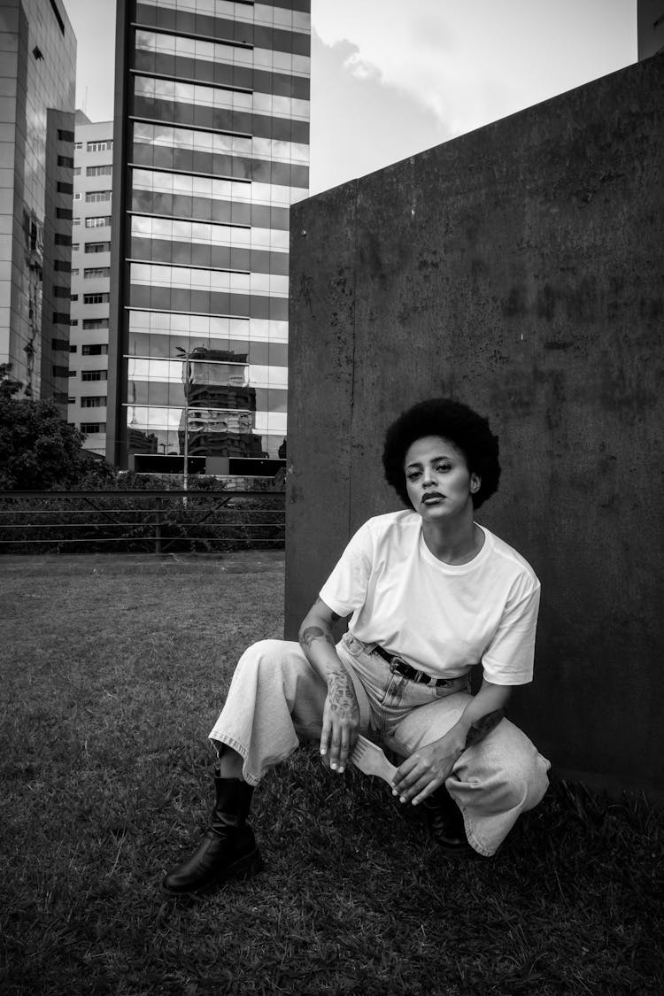 Young Woman In A Simple Outfit Posing Outside 