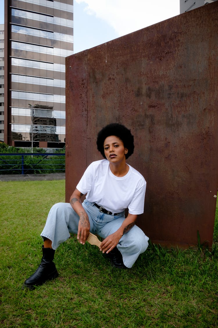 Young Woman In A Simple Outfit Posing Outside 