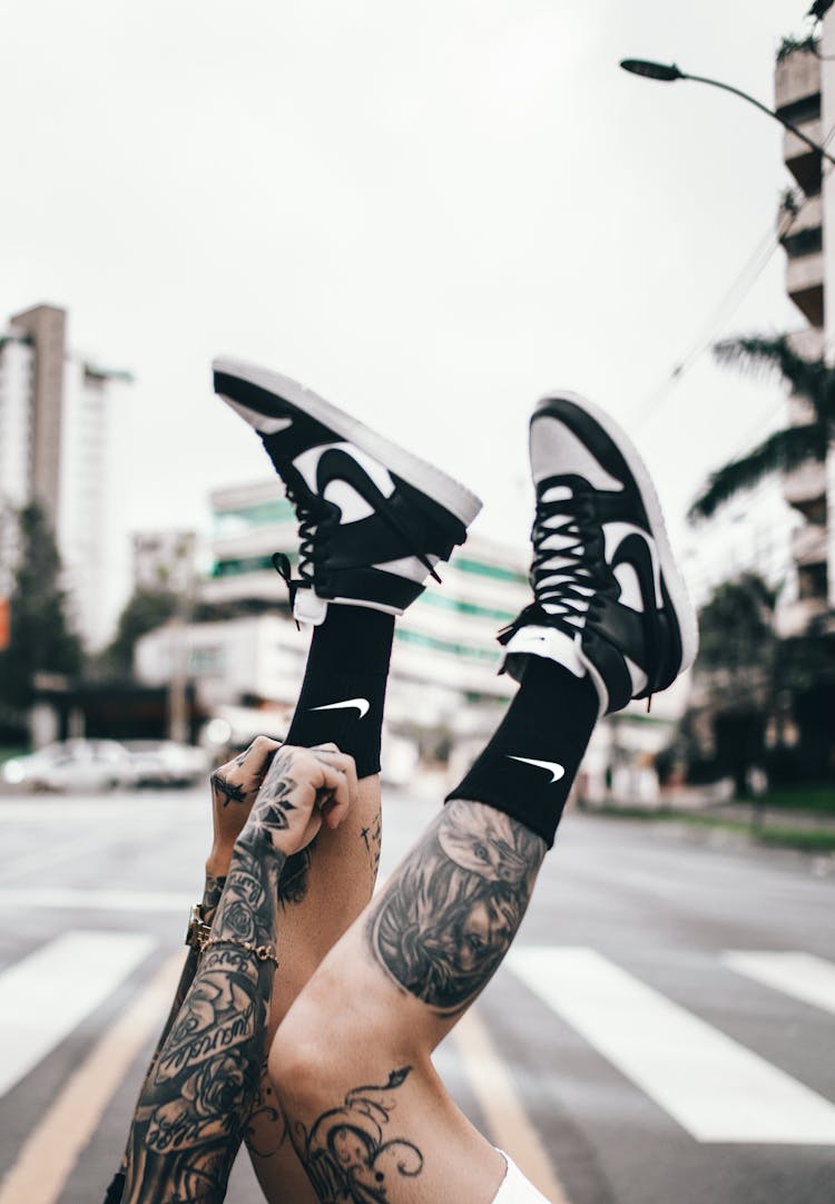 Nike Dunk High Retro Shoes And Nike Socks With A City Street In The Background