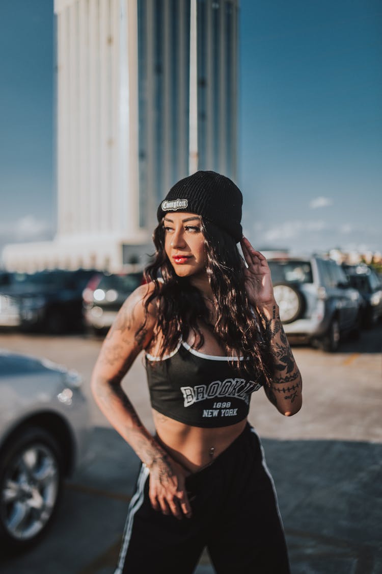 Girl In Sportswear Posing On Parking Lot