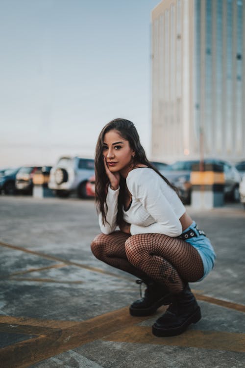 Young Woman Posing on Parking Lot