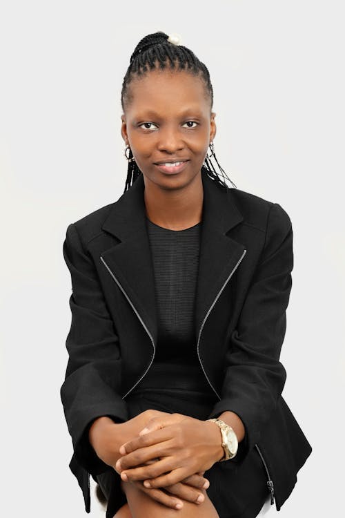 A Woman in Black Blazer Smiling and Posing