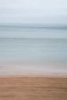 Peaceful beachscape with a calm sea and minimalistic horizon, perfect for relaxation themes.