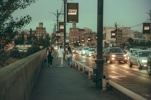 People Walking on the Sidewalk