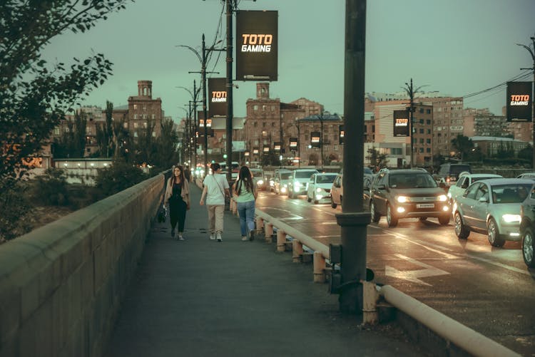 People Walking On The Sidewalk